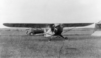 Black and white photo of an airplane on a field around 1947