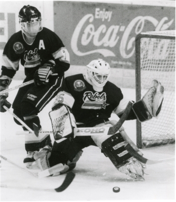 Black and white photo of the Red Deer Rebels goalie, Mark Dawkins, and defensemen, Kevin Masters