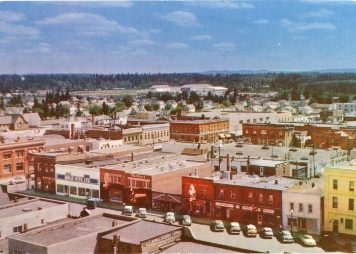 Colour aerial photo of buildings in downtown Red Deer in the 1950s.