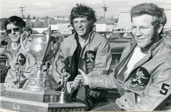 Brian Ogilvie, Terry Wedderburn, and Ken McLash from the Red Deer Rustlers hockey team pose with the Abbott Cup.