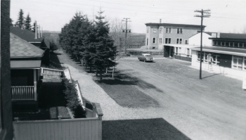 Black and white photo of both the new and old Monfort School