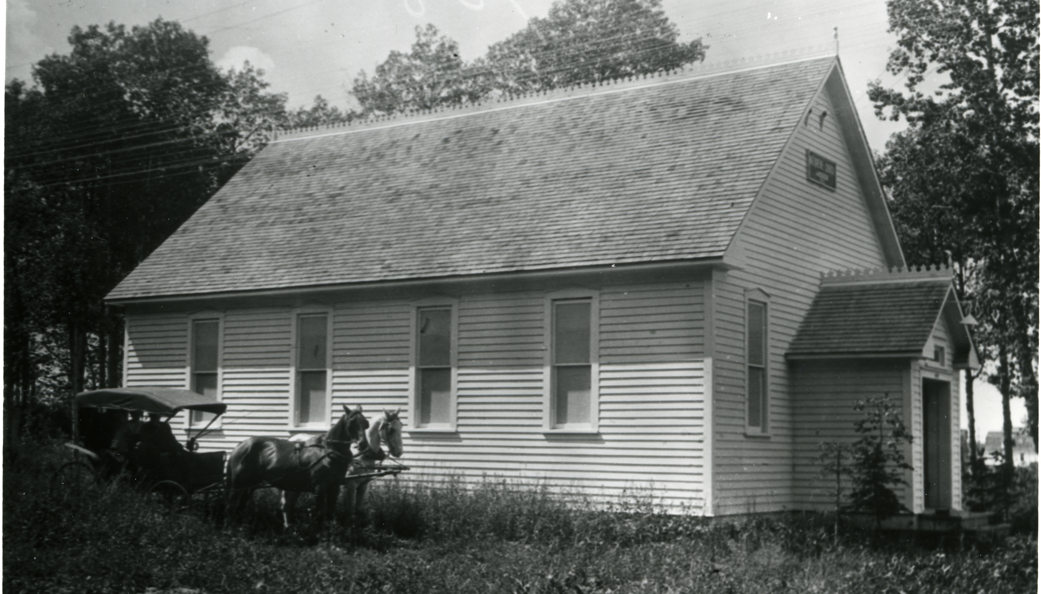 Black and white photo of the First Nazarene Church in Red Deer at the base of Michener Hill, which was later moved to 48 Avenue and 48 Street