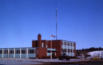 Coloured photo of the Royal Canadian Mounted Police building on 55th Street
