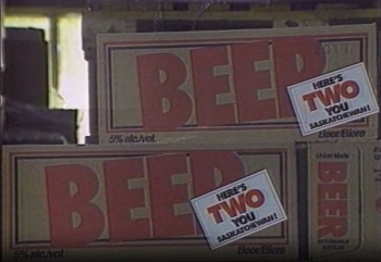 Screenshot of news clip featuring boxes of Drummond Beer Beer