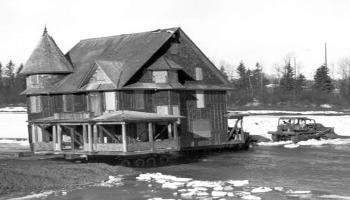 Cronquist House being moved across the Red Deer River to Bower Ponds in 1976