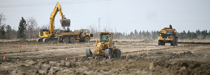 Heavy equipment developing land