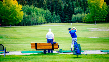 photo of two golfers at River Bend Golf Course